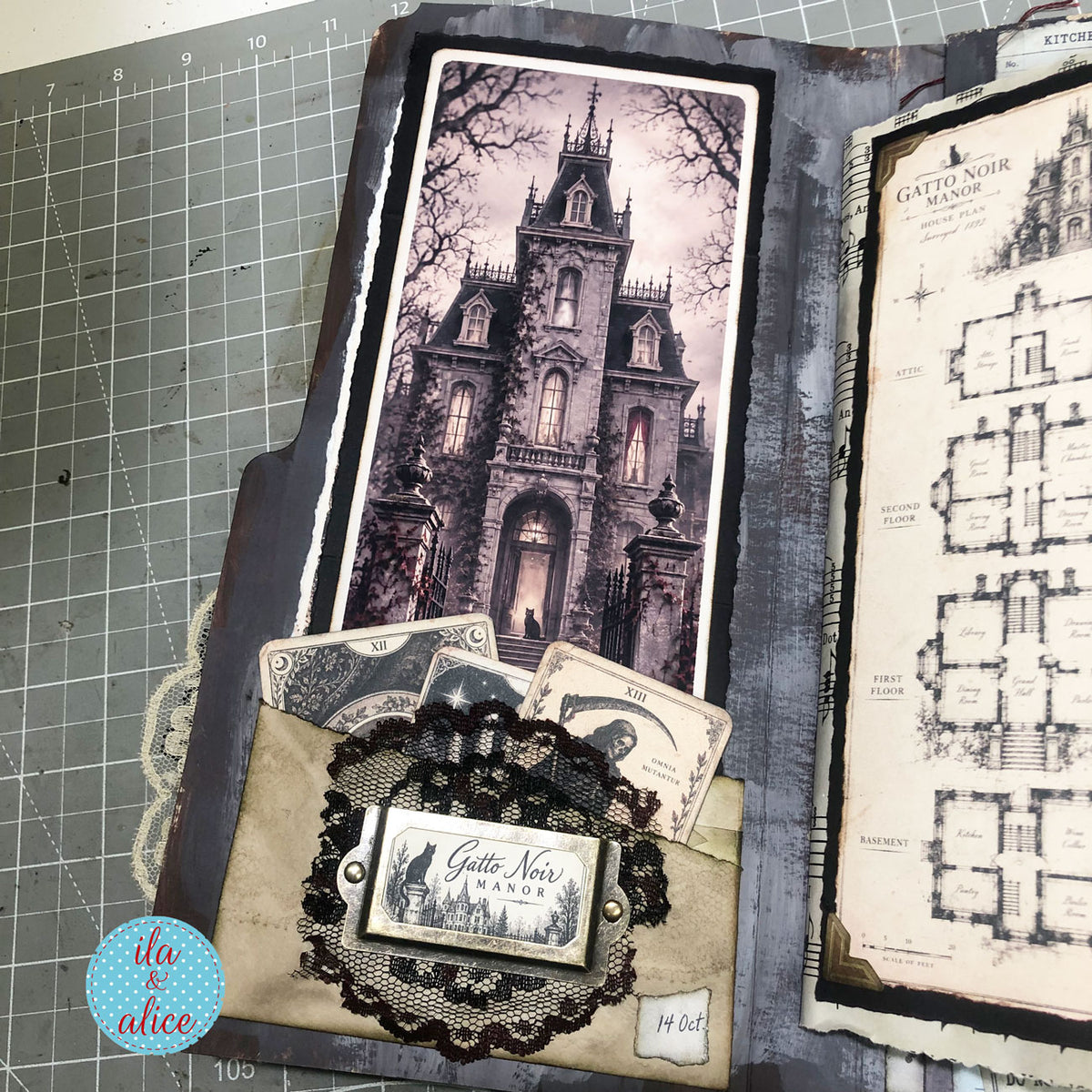 Open gothic junk journal with Gatto Noir Manor artwork and floor plan