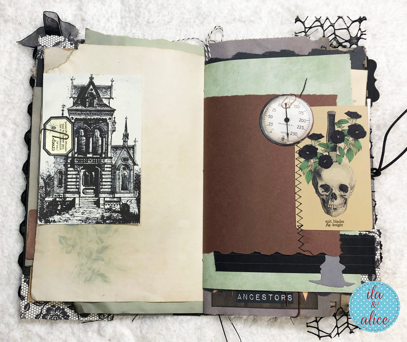 An open handmade scrapbook journal with a gothic theme, featuring layered brown and sage green paper, black lace trim, a vintage-style house illustration, a skull and rose graphic, a small clock, and the text 'ANCESTORS'.