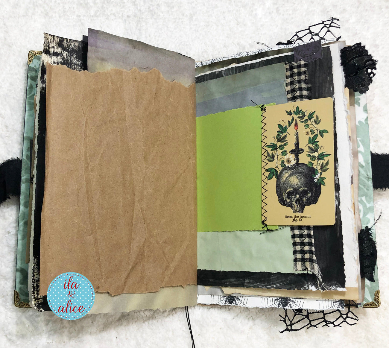 Handmade Eerie Halloween Gothic junk journal  with textured pages and decorative elements on a white background