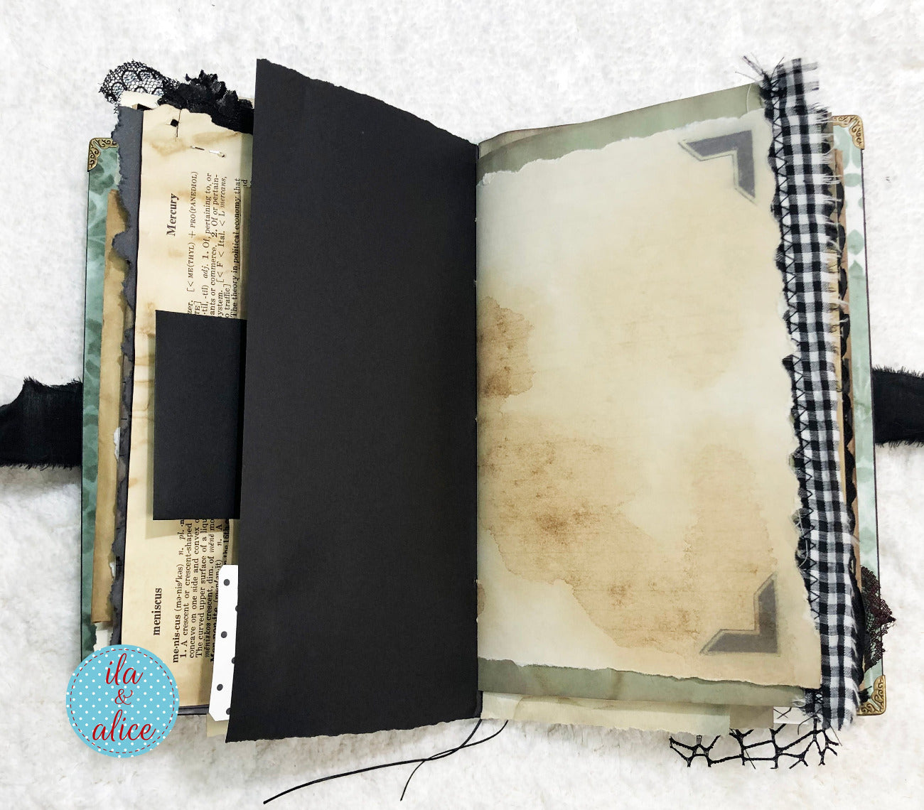 Handmade Eerie Halloween Gothic junk journal  with textured pages and decorative elements on a white background