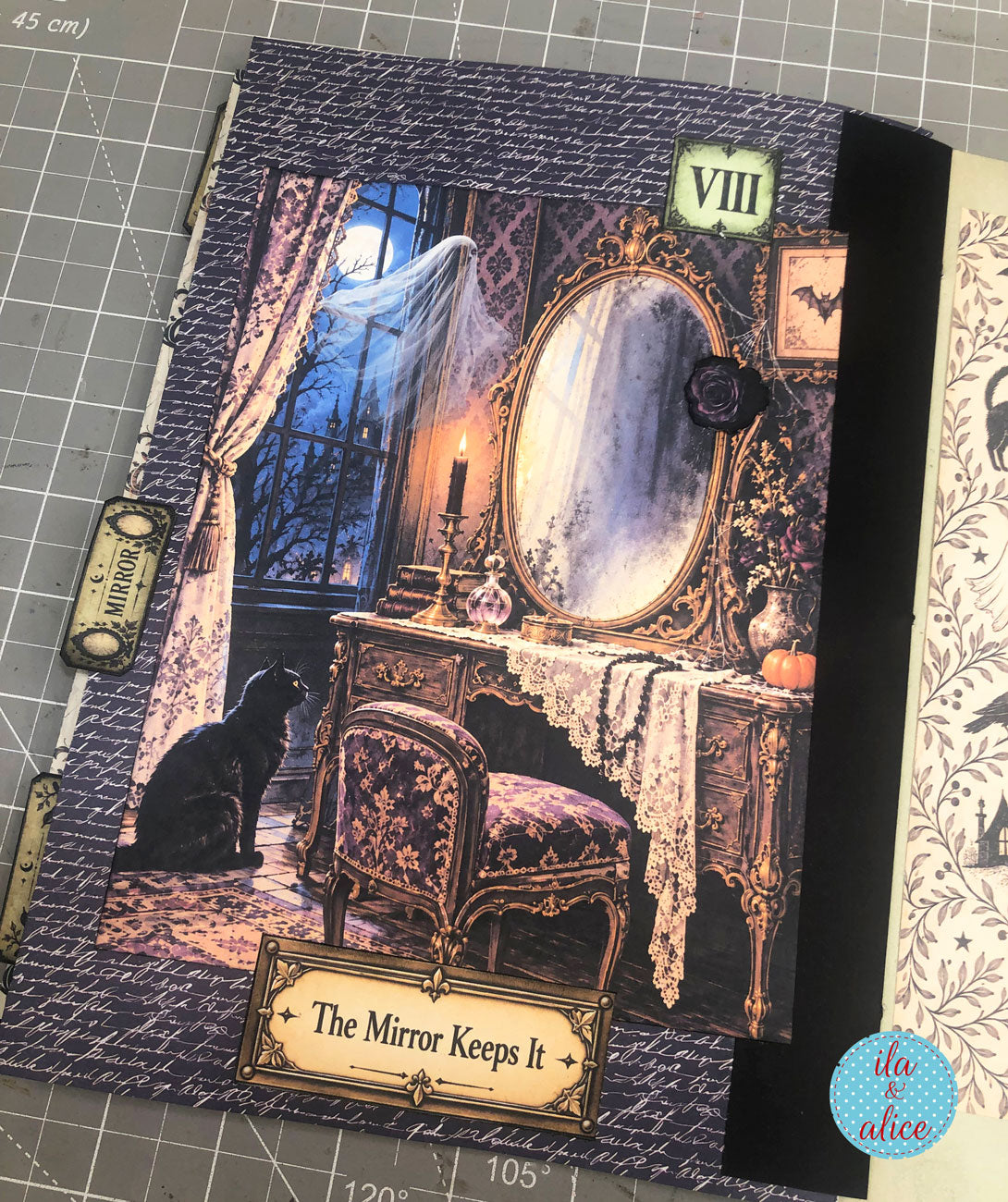 Interactive Halloween journal page with an ornate haunted mirror, black cat, moonlit window, gothic vanity, and a “The Mirror Keeps It” label.