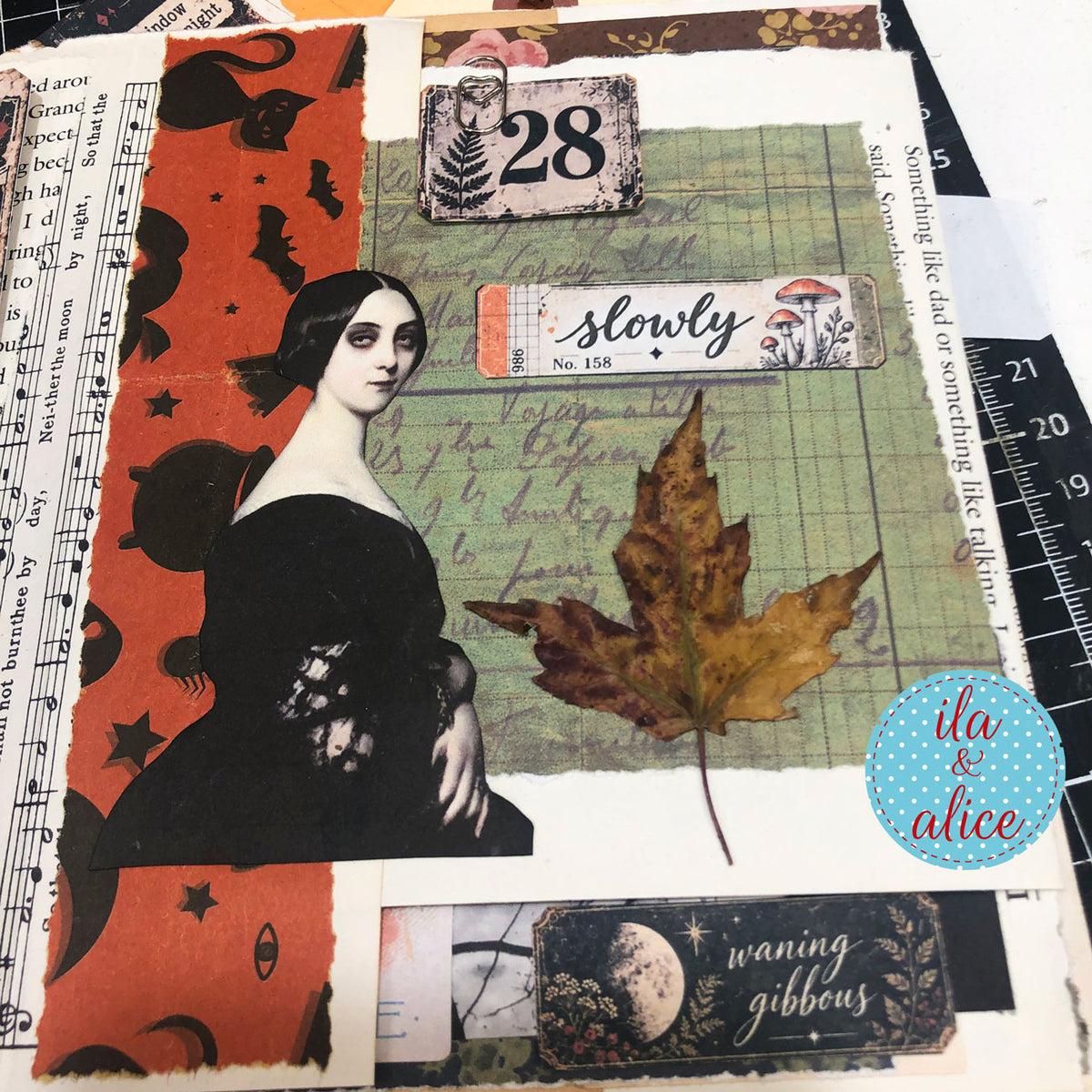 Autumn collage journal page with a vintage portrait, dried leaf, number tile and Autumn Findings “slowly” and waning gibbous labels.