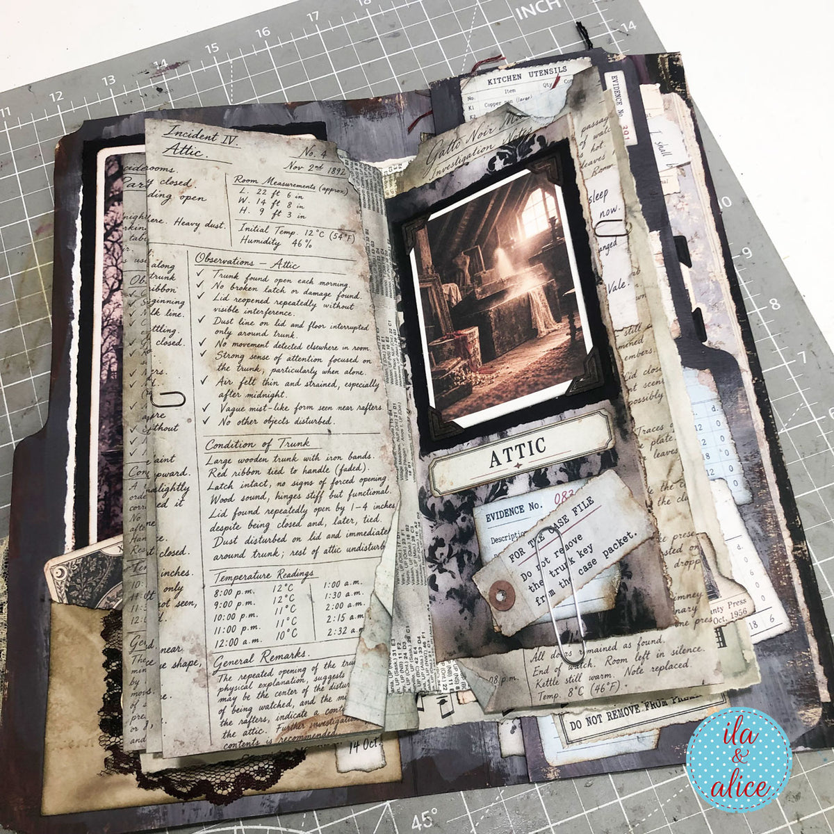 Open junk journal with handwritten page and dark Gatto Noir Manor attic photograph