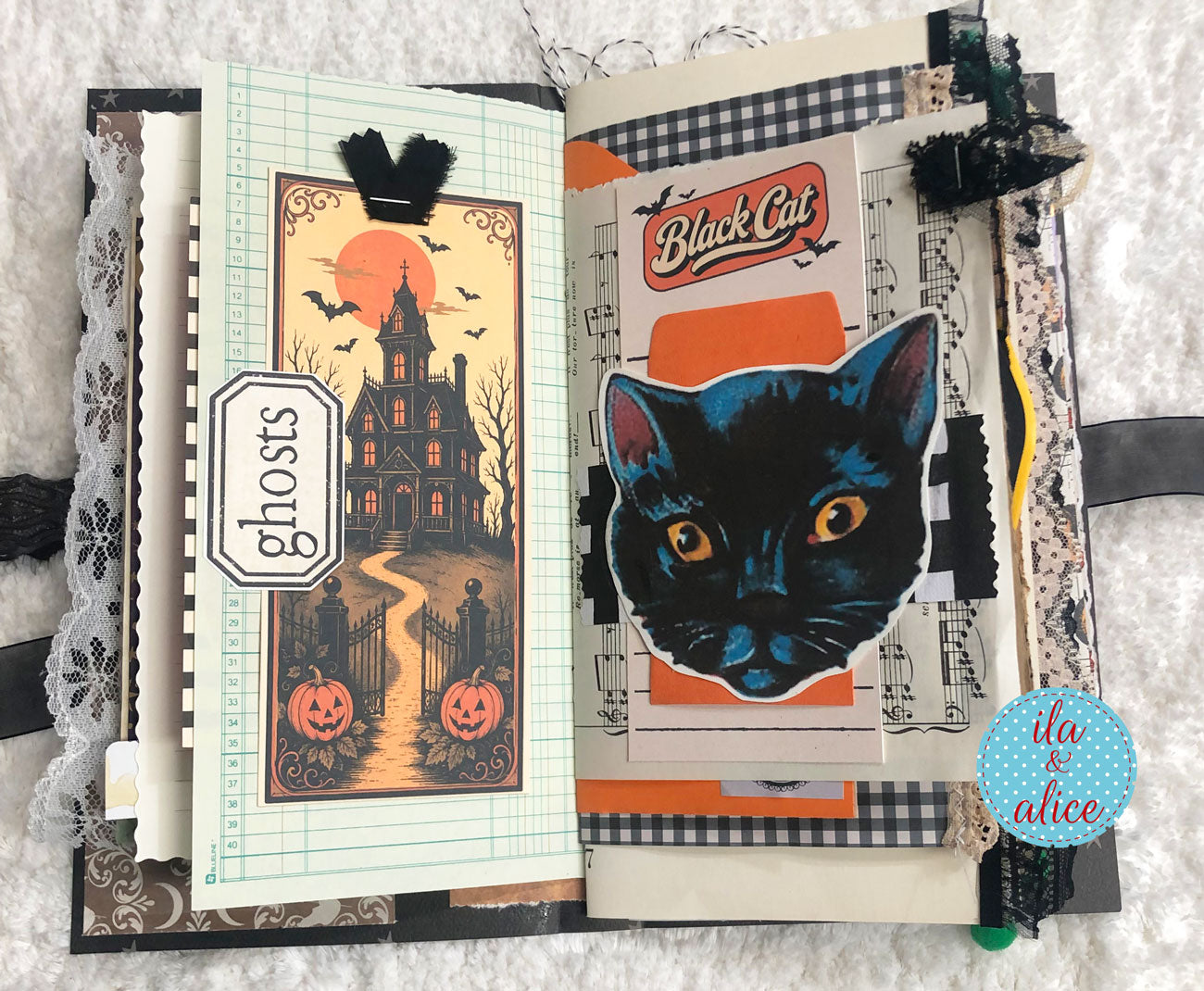 An open handmade Halloween scrapbook journal with two decorated pages. The left page features a spooky haunted house illustration under a full moon with pumpkins and a 'ghosts' label.